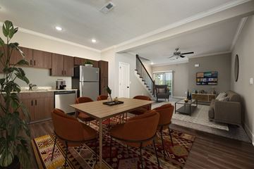 Riverside townhouse for rent - an open living room and kitchen with a dining room table and chairs