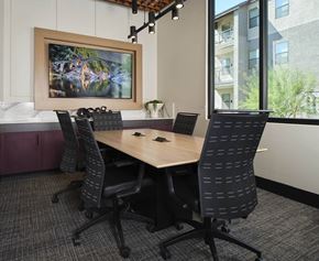 Phoenix apartment for rent - a conference room with a wooden table and chairs