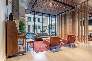 Portland apartment for rent - a living room with furniture and a piano in a lobby