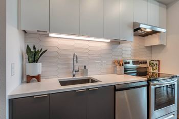 Quartz countertops & tile backsplashes