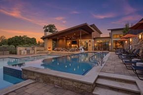 Frisco apartment for rent - A large house with a pool in the backyard.
