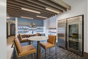 Frisco apartment for rent - A modern dining area with a table and chairs.
