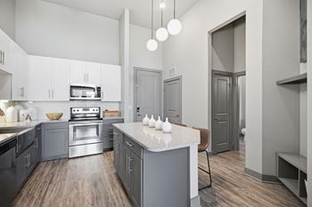 Stainless steel appliances including ceran top range & side-by-side refrigerator with ice & water dispenser