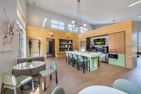 Englewood apartment for rent - A modern kitchen with a dining table and chairs.