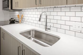Quartz countertops & subway tile backsplashes