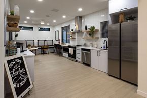 Spokane Valley apartment for rent - a kitchen with white cabinets and stainless steel appliances