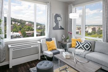 Large windows + city & mountain views