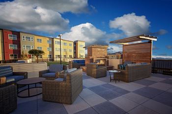 Sky deck with outdoor kitchen and gathering spaces