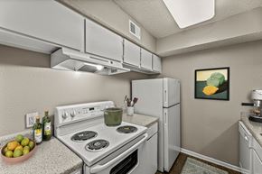 Dallas apartment for rent - our apartments have a kitchen with white appliances and granite counter tops at 5636 Apartment Homes, Dallas, TX  75254