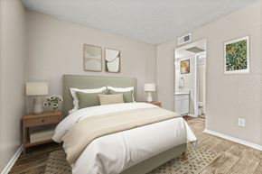 Dallas apartment for rent - a bedroom with a large bed and a closet at 5636 Apartment Homes, Dallas, Texas  75254