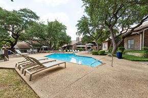 San Antonio apartment for rent - Pool with lounge chairs and trees at Carmel at Deerfield, Texas