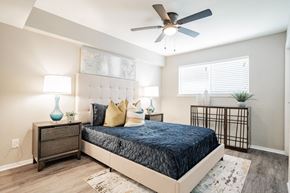 Dallas apartment for rent - a bedroom with a bed and a ceiling fan at Aero White Rock, Dallas, Texas