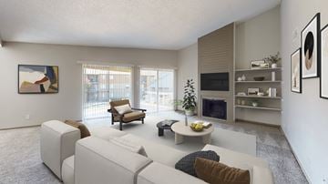 Dallas apartment for rent - A living room with a white couch and a television.