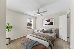 North Richland Hills apartment for rent - a bedroom with a bed and a ceiling fan at The Hudson, North Richland Hills, Texas