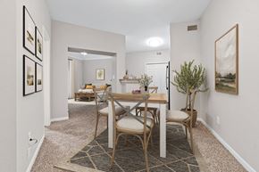 Denton apartment for rent - a dining room with a wooden table and chairs at Fountains of Denton in Denton, TX