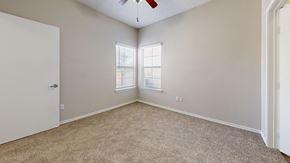 Weatherford apartment for rent - an empty bedroom with two windows and a ceiling fan at Southgate Glen, Texas