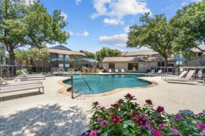Dallas apartment for rent - a pool with lounge chairs and trees in the background  at Vesper, Texas