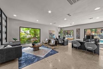 Grapevine apartment for rent - A modern living room with a grey sofa and a coffee table.