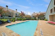 Irving apartment for rent - A swimming pool surrounded by a stone border with the number 37161 painted on it.