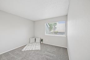 Irving apartment for rent - A bedroom with a window and a bed.