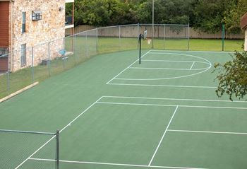 A tennis court with a net on top of it