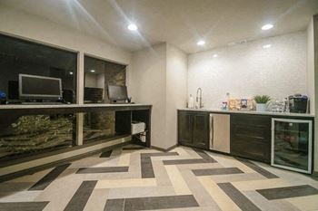 A room with a desk and a television in it