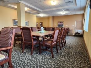 Norwood Young America apartment for rent - Community room with a table surrounded by chairs.