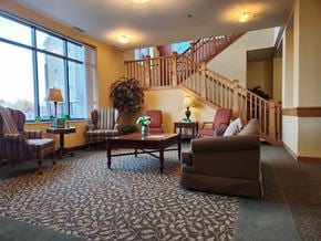 Norwood Young America apartment for rent - Common area with a staircase and a couch.