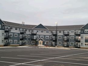 Waconia apartment for rent - an empty parking lot in front of an apartment building