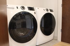 Carver apartment for rent - A front load washing machine and dryer in a closet.