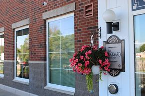 Chaska apartment for rent - Front door of Brickyard Apartments with sign that says "Brickyard Apartments"