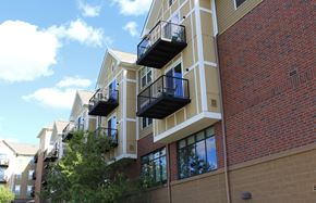 Norwood Young America apartment for rent - A building with balconies and a brick wall.