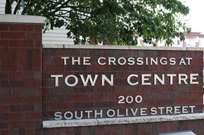 Waconia apartment for rent - A sign for The Crossings at Town Centre on South Olive Street.