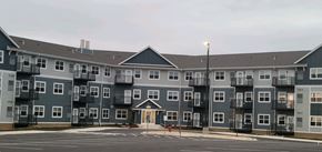 Waconia apartment for rent - a large apartment building on the corner of a parking lot