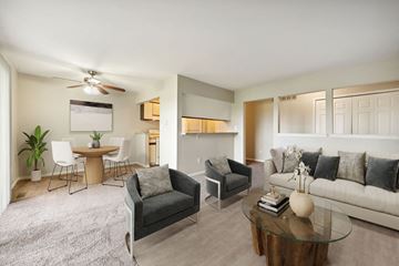 Flint apartment for rent - a living room with a couch and a table