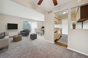 Flint apartment for rent - a living room with a kitchen and a dining room