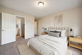 Flint apartment for rent - a bedroom with a bed and a closet
