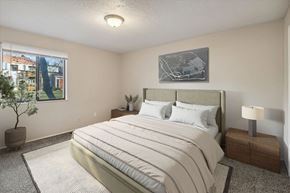 Flushing apartment for rent - a bedroom with a bed and a window