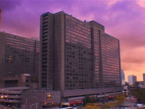 Cleveland apartment for rent - A large building with many windows is in the foreground.