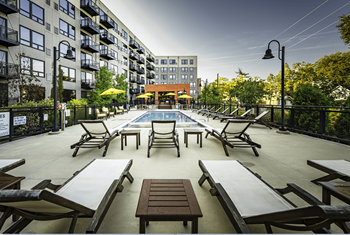 Sparkling sun deck with pool and hot tub