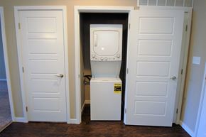 Fort Wayne apartment for rent - A white oven is in a small space between two doors.