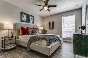 San Antonio apartment for rent - a bedroom with a bed and a ceiling fan
