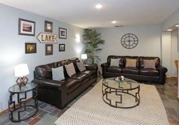 Spring Park apartment for rent - a living room with two leather couches and a table