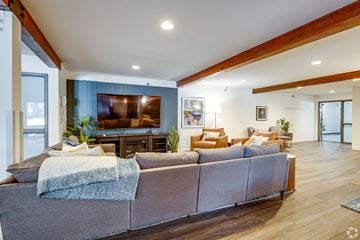 Minnetonka apartment for rent - A living room with a grey couch and a wooden floor.