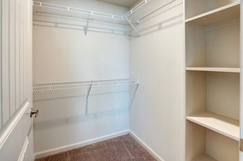 Walk-in closet with upper and lower wire shelving