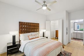 Austin apartment for rent - Bedroom with geometric headboard and ceiling fan at Matador Apartments, Austin, TX 78745