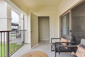 Covered patio with seating area and storage closet