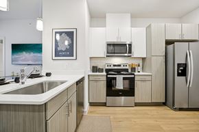Austin apartment for rent - Kitchen with white countertops and stainless steel range at Matador Apartments, Austin, 78745