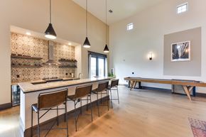 Del Valle apartment for rent - Open concept kitchen with bar seating and game table at Eastridge Apartments, Del Valle, Texas