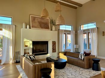 A living room with a fireplace and a couch.